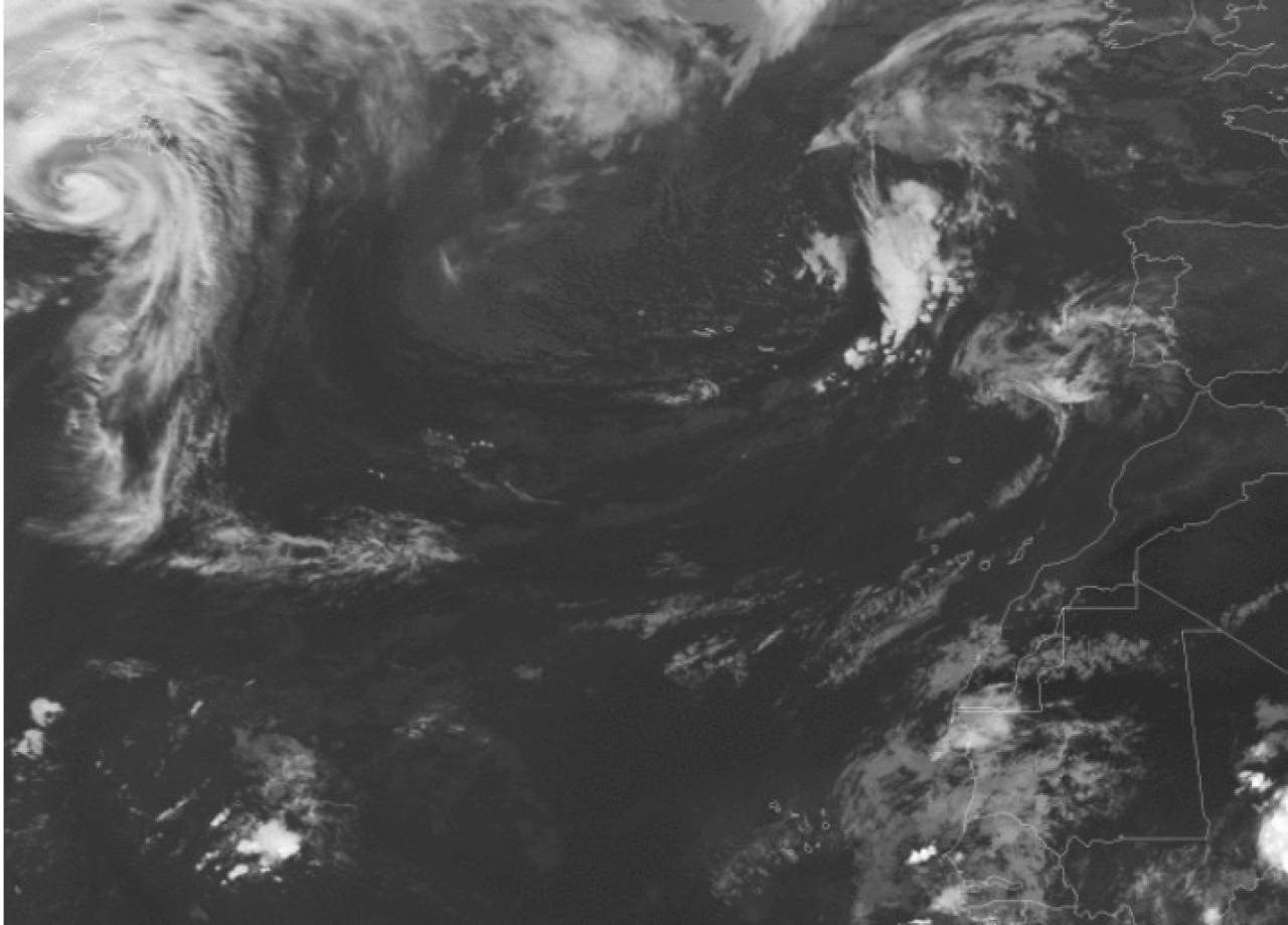 In the upper left corner, a lorry hurricane seen from a satellite